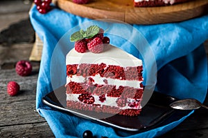 Red velvet cake on wood board. Slice of cake. Raspberry cake. Devil`s cake. Wedding dessert. Birthday cake. Delicious