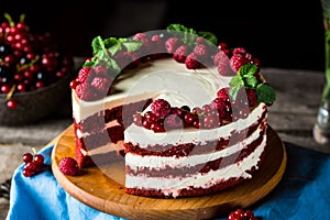 Red velvet cake on wood board. Slice of cake. Raspberry cake. Devil`s cake. Wedding dessert. Birthday party. Delicious dessert.