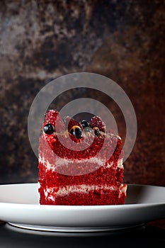 Red velvet cake on wood board. Slice of cake. Raspberry cake. Devil`s cake. Wedding dessert.Delicious dessert