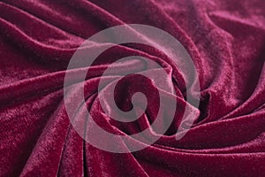 Red velvet fabric with spiral folds