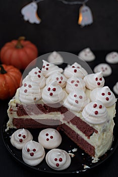 Red velvet halloween cake with meringue ghosts