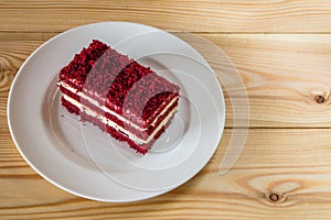Red velvet slice of cake on white plate