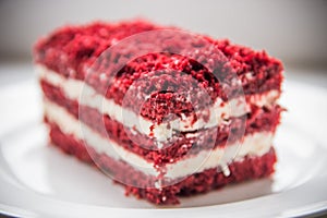 red velvet slice of cake on white plate