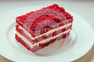 red velvet slice of cake on white plate