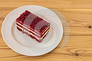 red velvet slice of cake on white plate