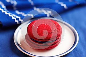 a red velvet whoopie pie against a royal blue cloth