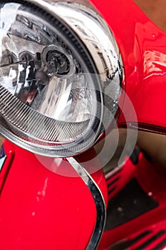 Red Vespa scooper design.