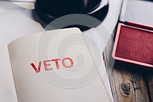 Red veto stamp in notepad