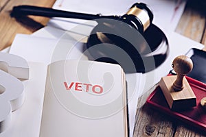 Red veto stamp in notepad photo