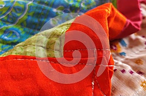 Red vibrant woollen weaved quilt patchwork