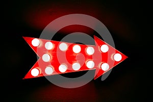 Red arrow: red vintage bright and colorful illuminated display arrow sign