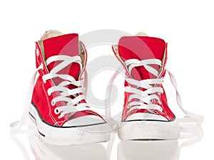 Red vintage canvas sneakers untied