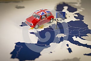 Red vintage car with Union Jack flag over an UE map and flag.