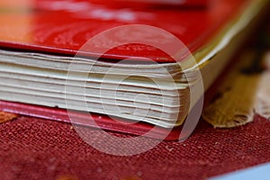 Red vintage Chinese notebook with vinyl cover. detail