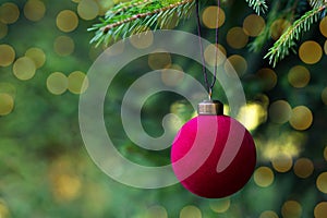 Red vintage Christmas ball on fir branch. Christmas background. Close-up. Copy space. Selective focus