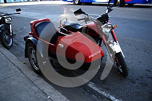 Red vintage motorcycle with sidecar