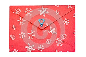 red vintage paper envelope with old metallic soda Can ring pull and snowflakes