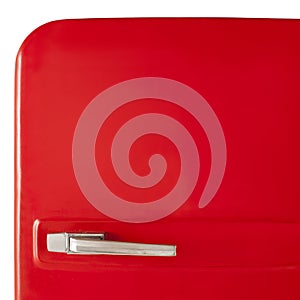 Red vintage refrigerator isolated on white background