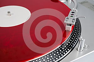 Red vinyl record on the player