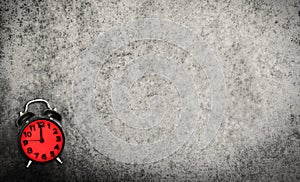 Red Vitnage Clock on grunge cement background