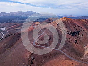 Red volcanic mountains with craters  in Timanfaya national park in Lanzarote island, Spain