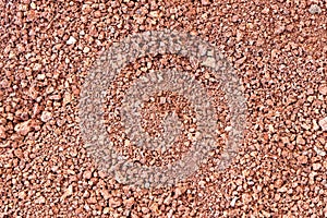 Red volcanic stones soil texture in National Park of Timanfaya - Lanzarote - Spain