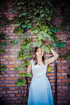 Red Wall, Green Vine, Girl