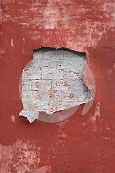 Red wall with hole