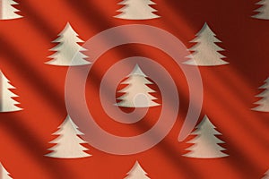 Red wall with moody shadows and Christmas trees pattern.