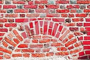 Red wall. Old brick texture. Irregular pattern.