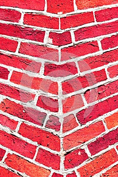 Red wall. Old brick texture. Irregular pattern.