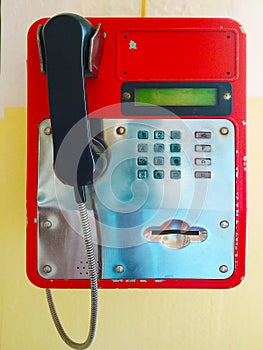 Red wall phone with metal insert