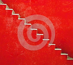Red wall with stairs texture background, minimalistic style photo