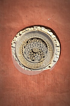 Red wall and stone friezes Zica Monastery