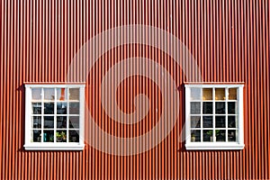 Red wall and two windows