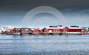 Red warehouse of fishing village industry with on harbor