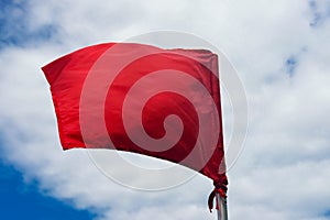 Red warning flag at the beach
