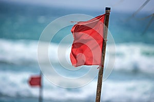 Red warning flag on beach