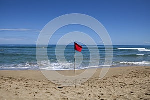Red warning flag at Cocles beach, Costa Rica