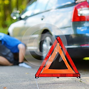 Red warning triangle sign on the road