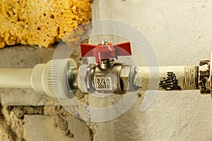 red water tap on a heating battery