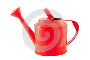 Red watering can on a white background