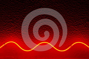 Red waved neon lamp.