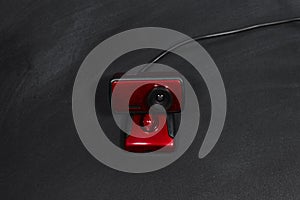 Red web camera on blackboard. e-learning scool