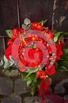 Red wedding bouquet on a dark background