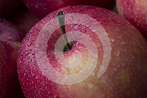 red wet apple with big droplet, macro shot