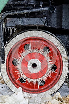 Red wheel and detail of mechanism a vintage russian steam train locomotive