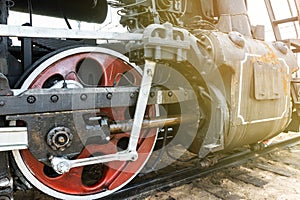 Red wheel and detail of mechanism a vintage russian steam train locomotive