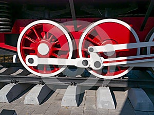 Red wheels of an old railway locomotive