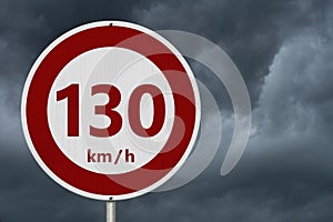 Red and white 130 km speed limit sign